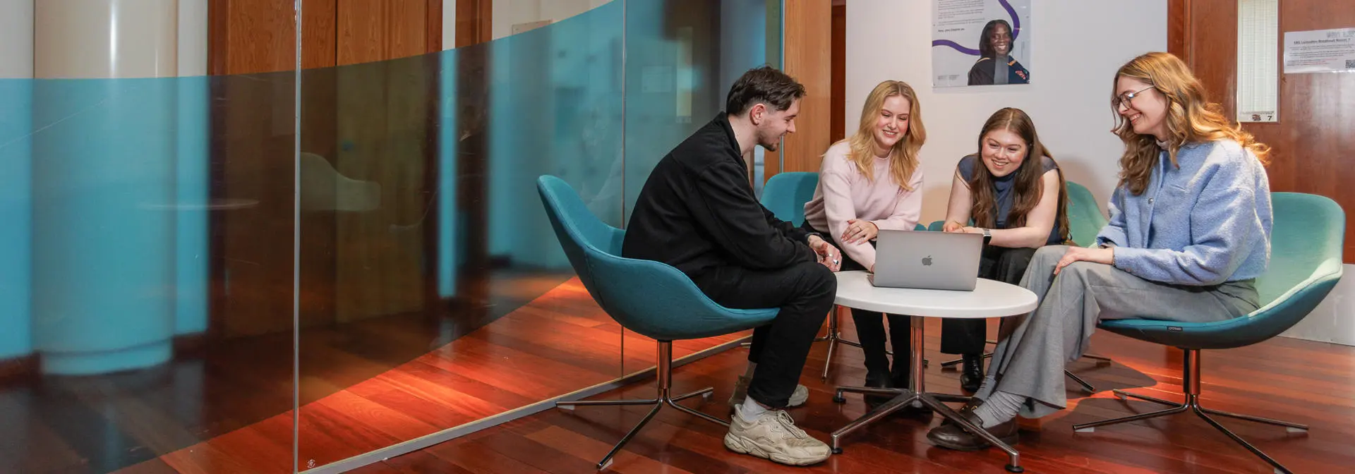 Students working in a group in a common area