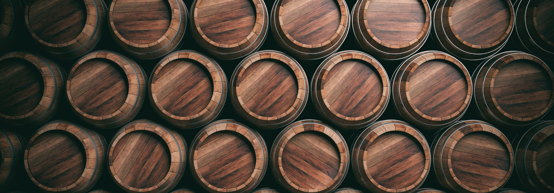 Wooden barrels stacked in rows.