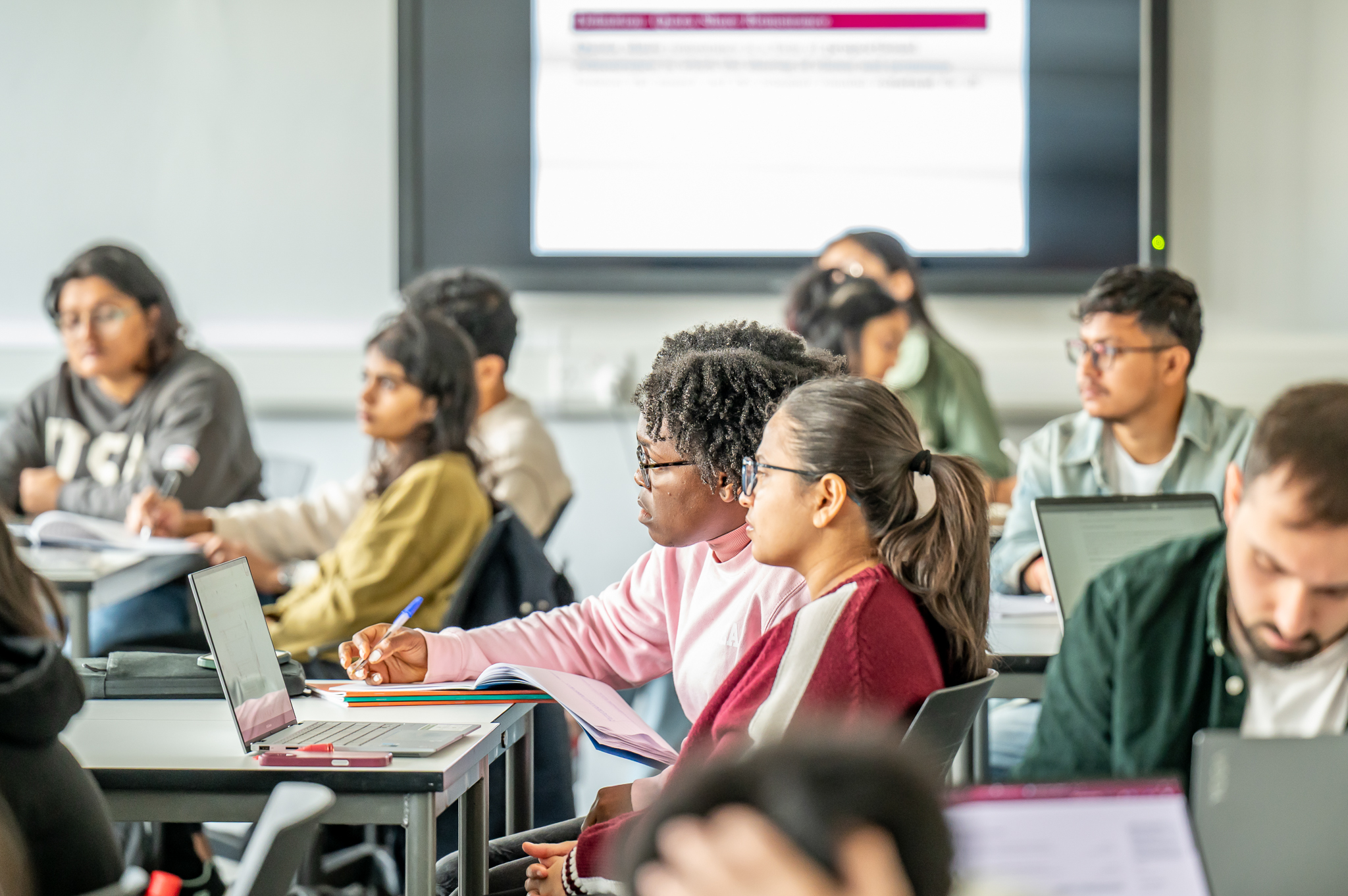 Students having a lecture in classroom