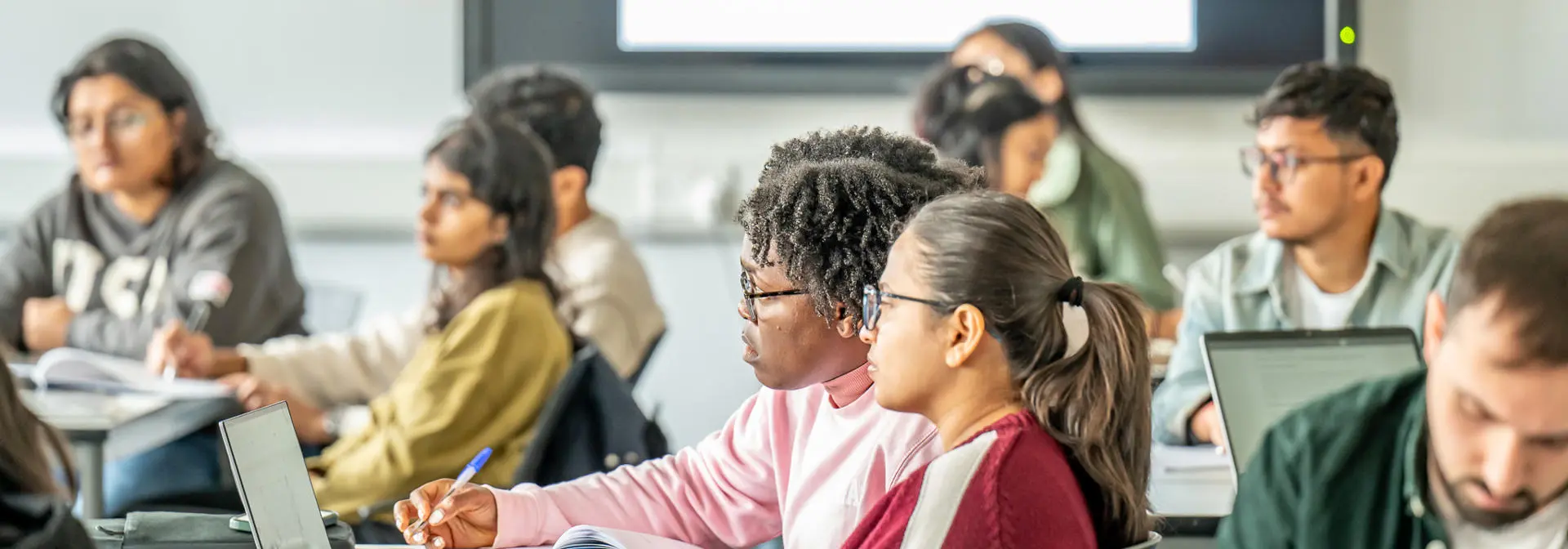 Students having a lecture in classroom