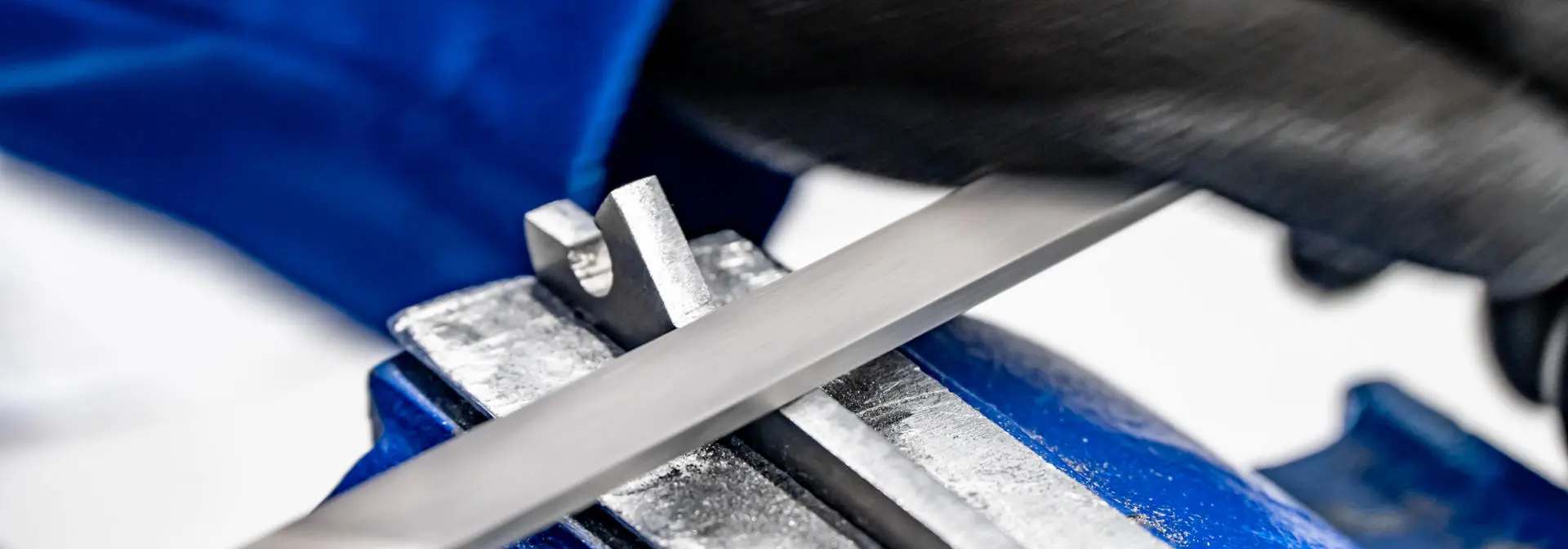 Close up image of a student using a lathe