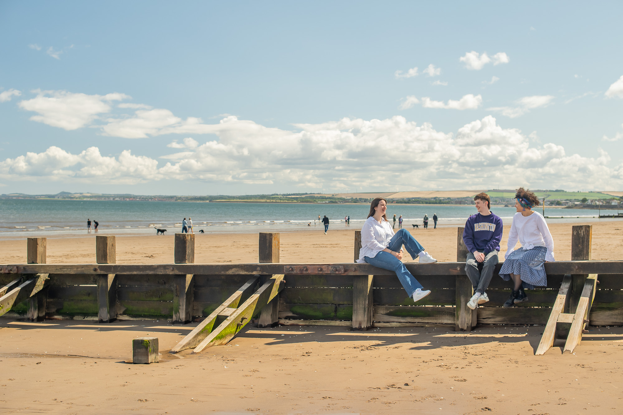 Students talking on a beach