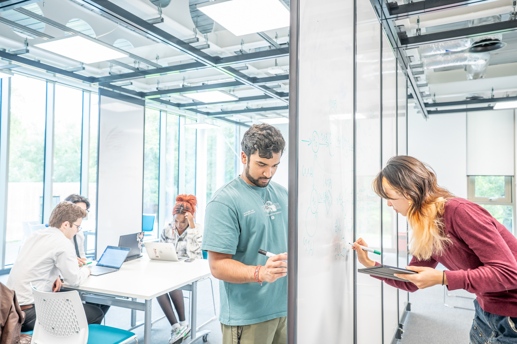 Students working on a whiteboard