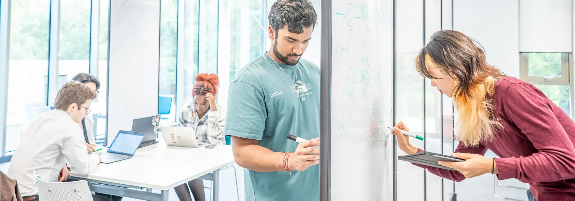Students working on a whiteboard