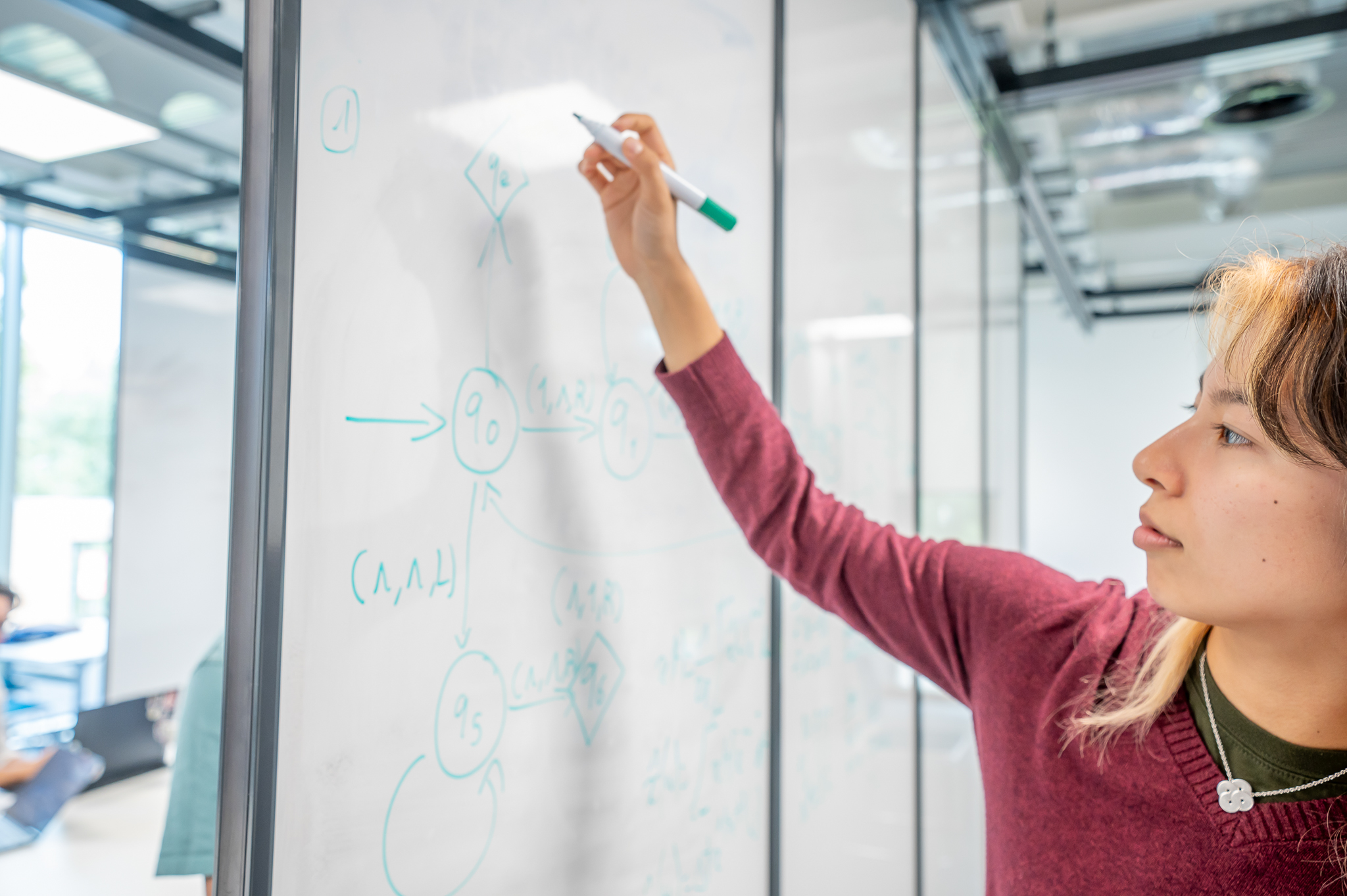 Student working on a whiteboard