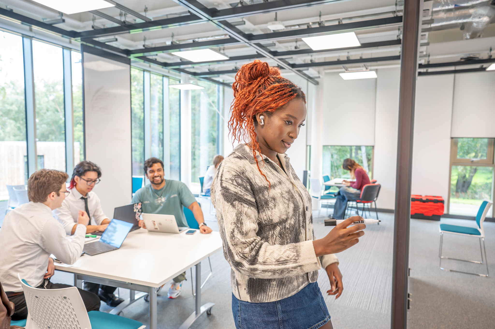 Student writing on a whiteboard
