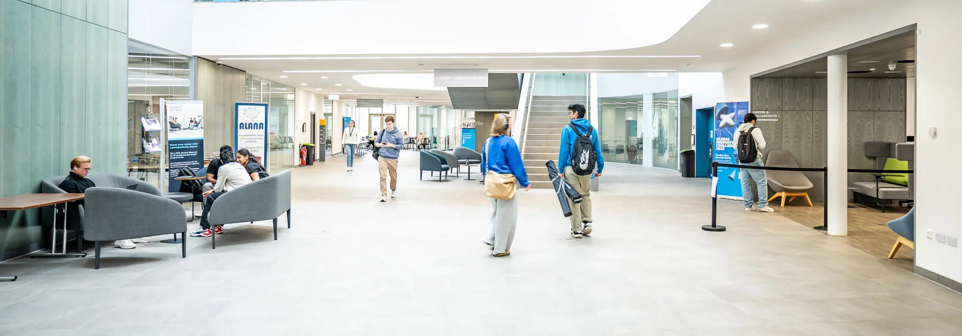 Students walking around in the Heriot-Watt GRID building