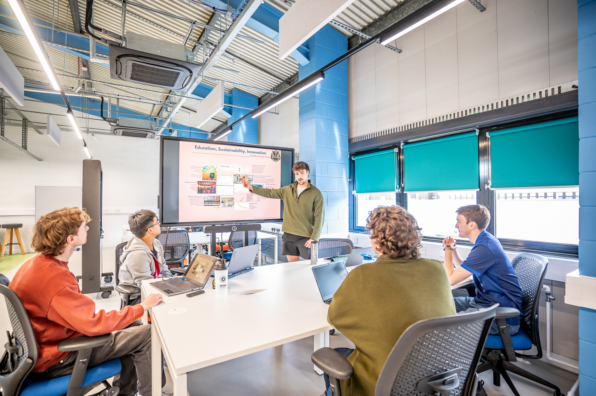 Student giving a presentation to other students