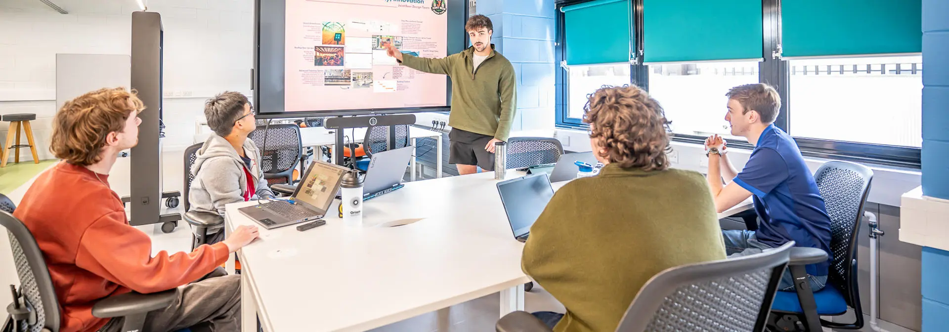 Student giving a presentation to other students