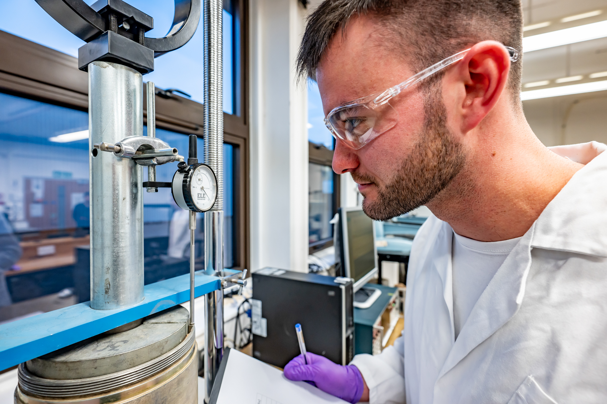 Student performing a pressure test in a lab