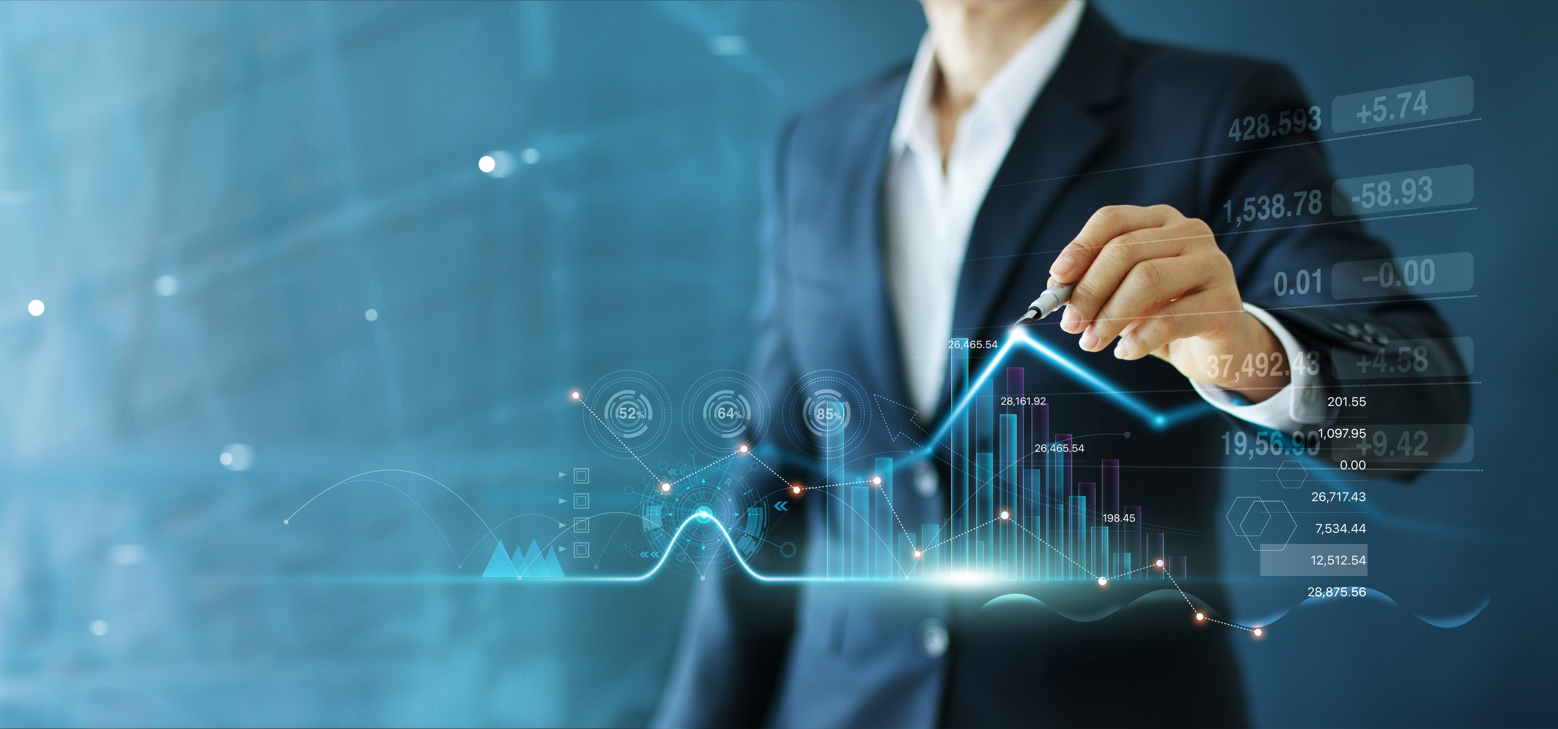 A person in a suit interacts with digital graphs, charts, and stock market data.