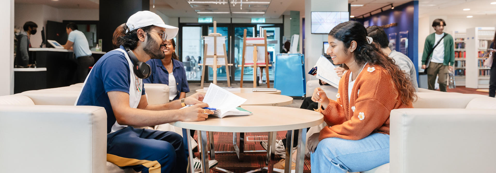 Students working together in reception hall
