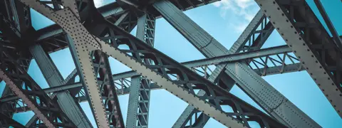 Metal beams demonstrating strong structural engineering.