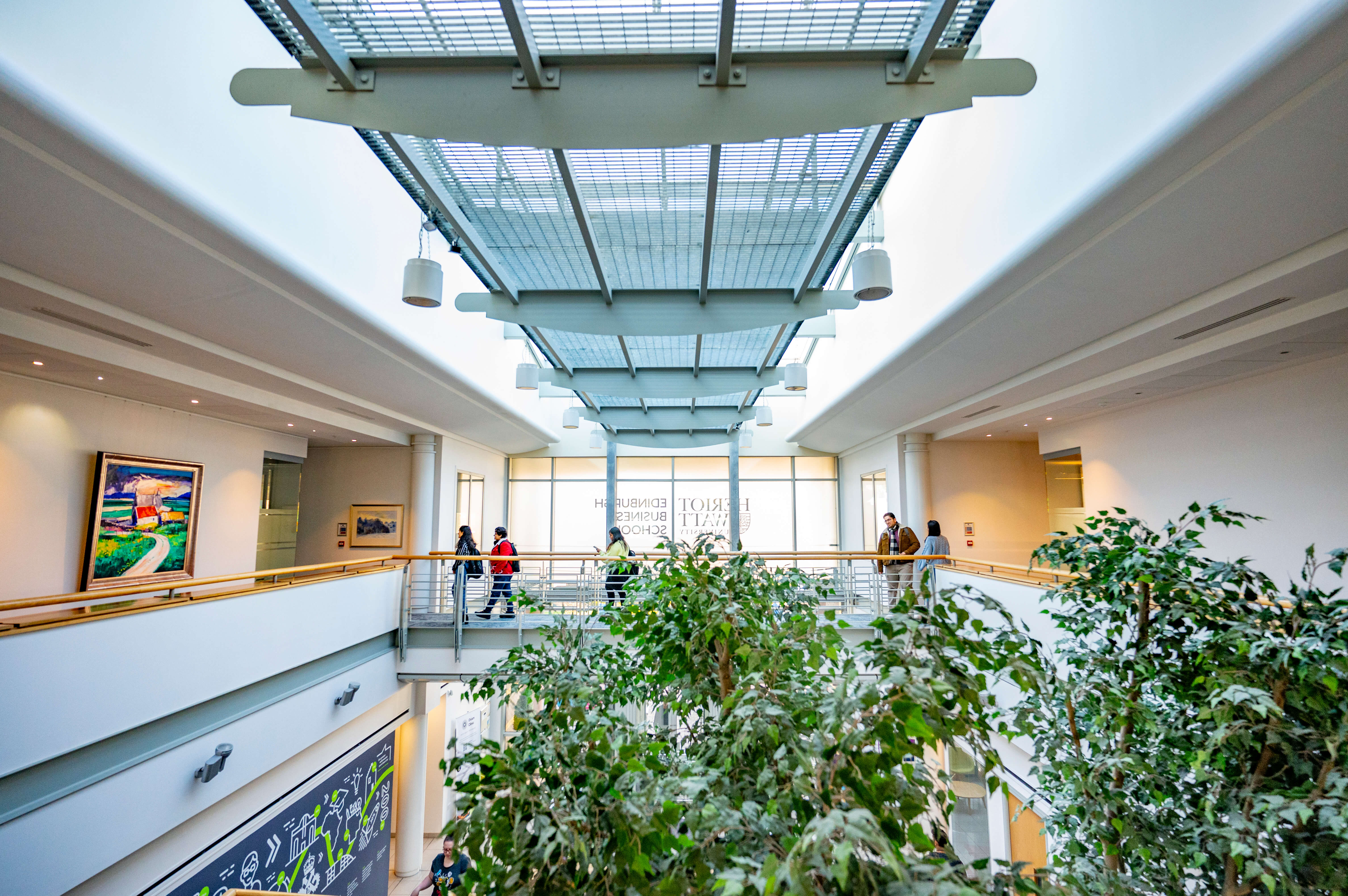 Students cross the landing in the Edinburgh Business School