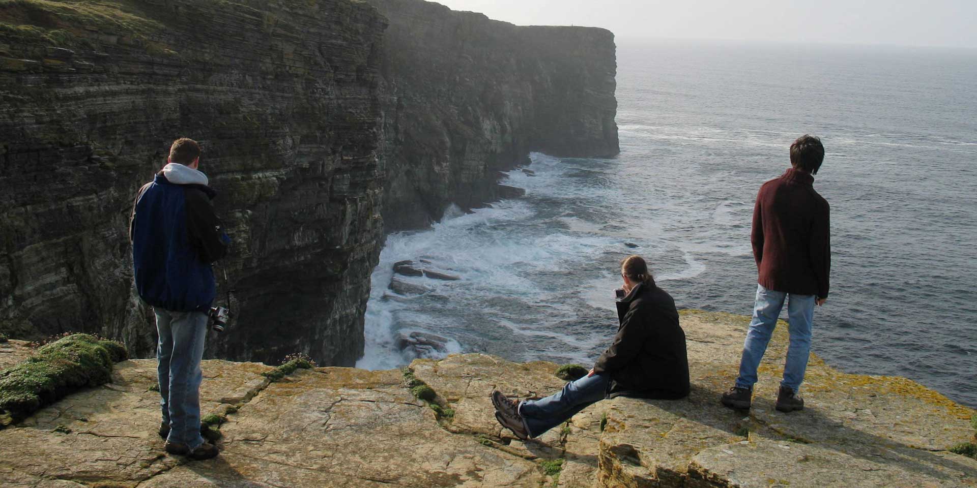 students-cliff-sea