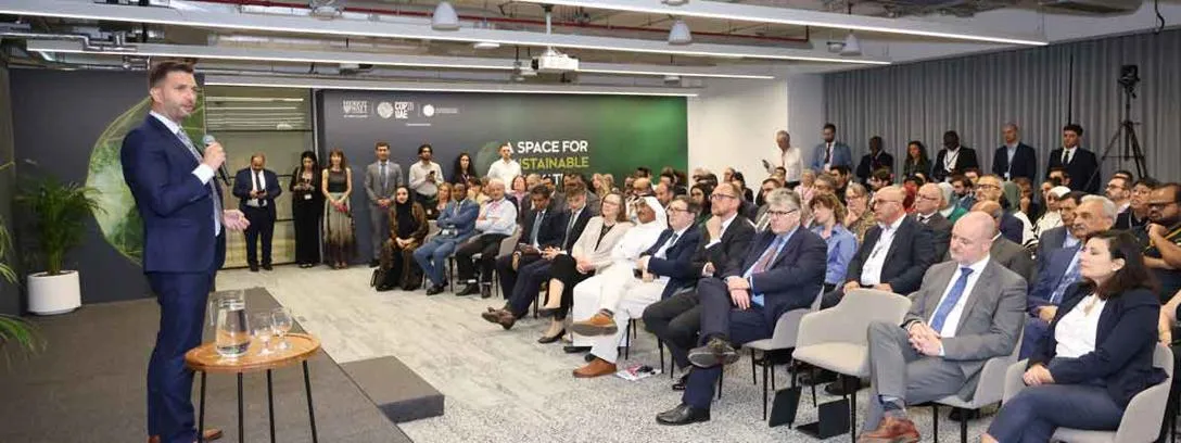 The Heriot-Watt Climate Hub, hosted on the Dubai campus during COP28, showcased innovative enterprises as part of a CleanTech Exhibition. Tadhg O'Donovan speaking to Climate Hub exhibition guests