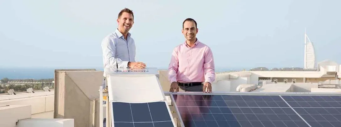 Prof. Tadhg O'Donovan and Dr Mohamed Al-Musleh at the Renewable Energy Test Site in Dubai. Prof. Tadhg O'Donovan and Dr Mohamed Al-Musleh standing beside solar panels