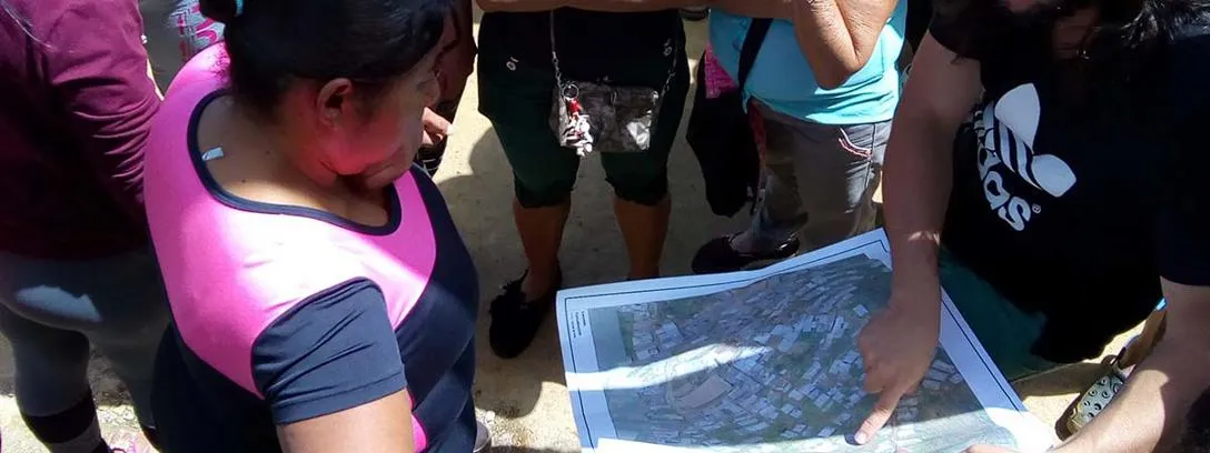 Community mapping in Medellin, Colombia People looking at map