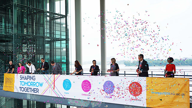 Staff launching Strategy 2025, surrounded by confetti