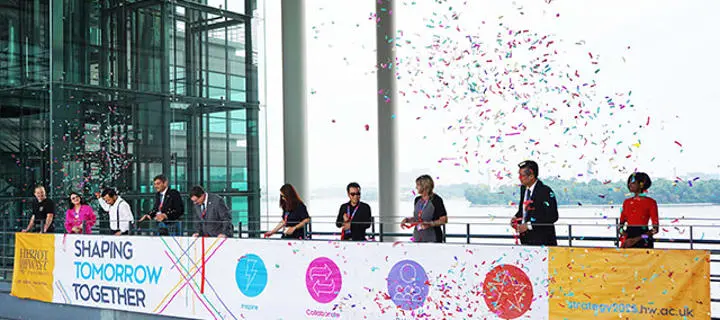Staff launching Strategy 2025, surrounded by confetti