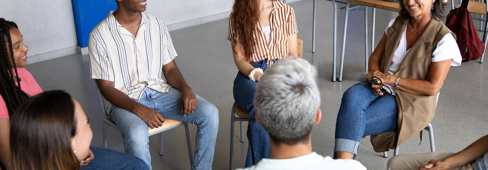 Students in a classroom sitting in a focus group setting.