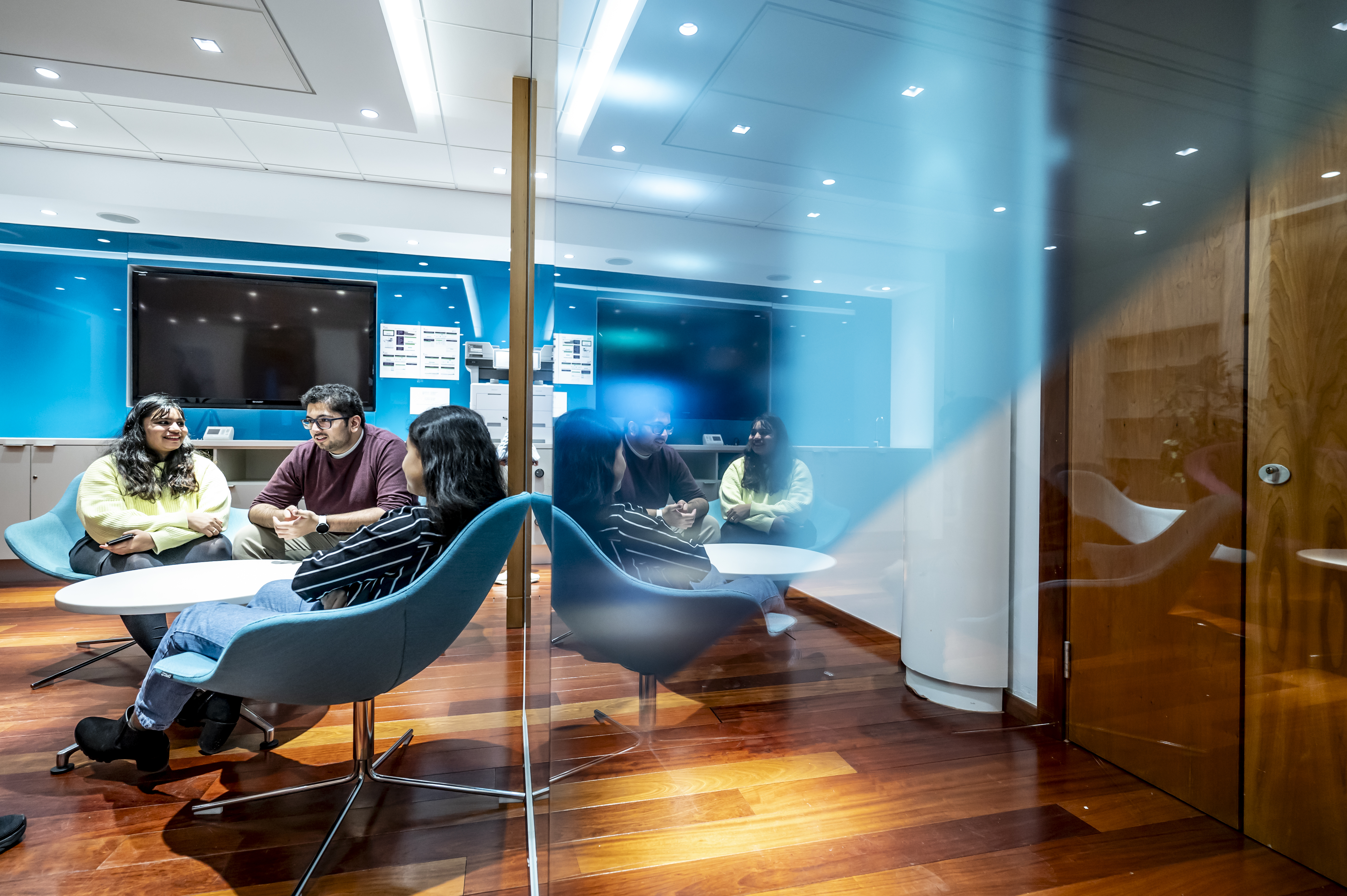 Three students meeting in a break out space