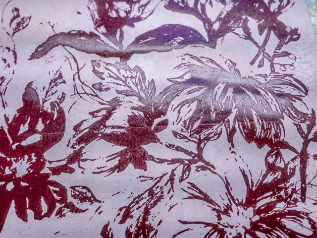 A red floral pattern on material.