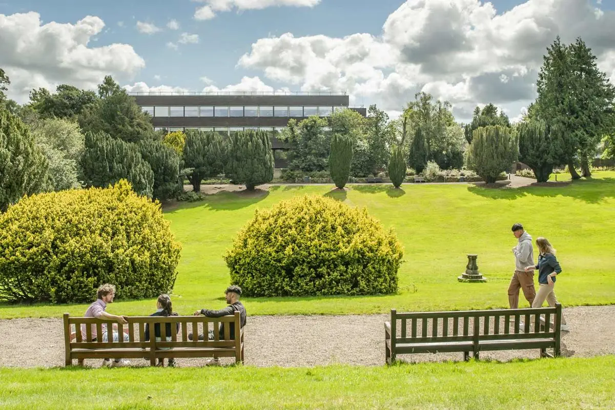 Students chat as the walk through the campus grounds.