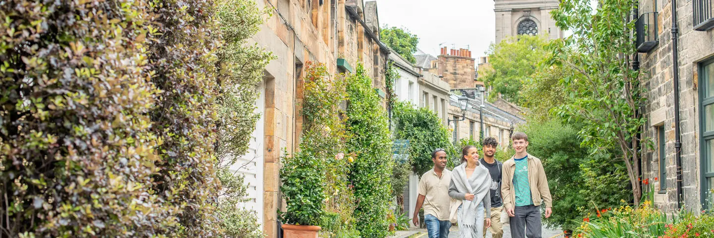 Four students walking down Circus Lane in Edinburgh