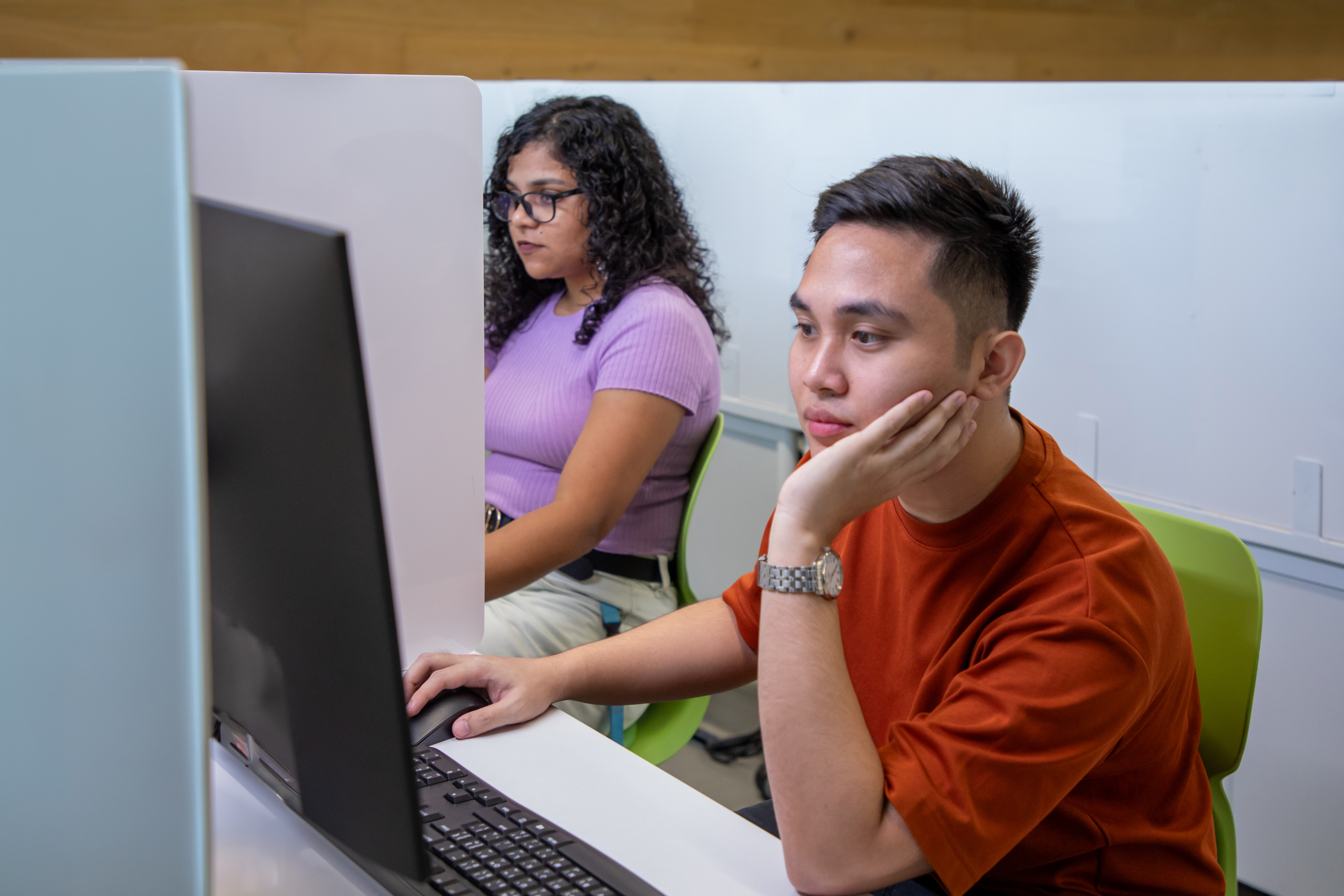 Students interacting on a computer