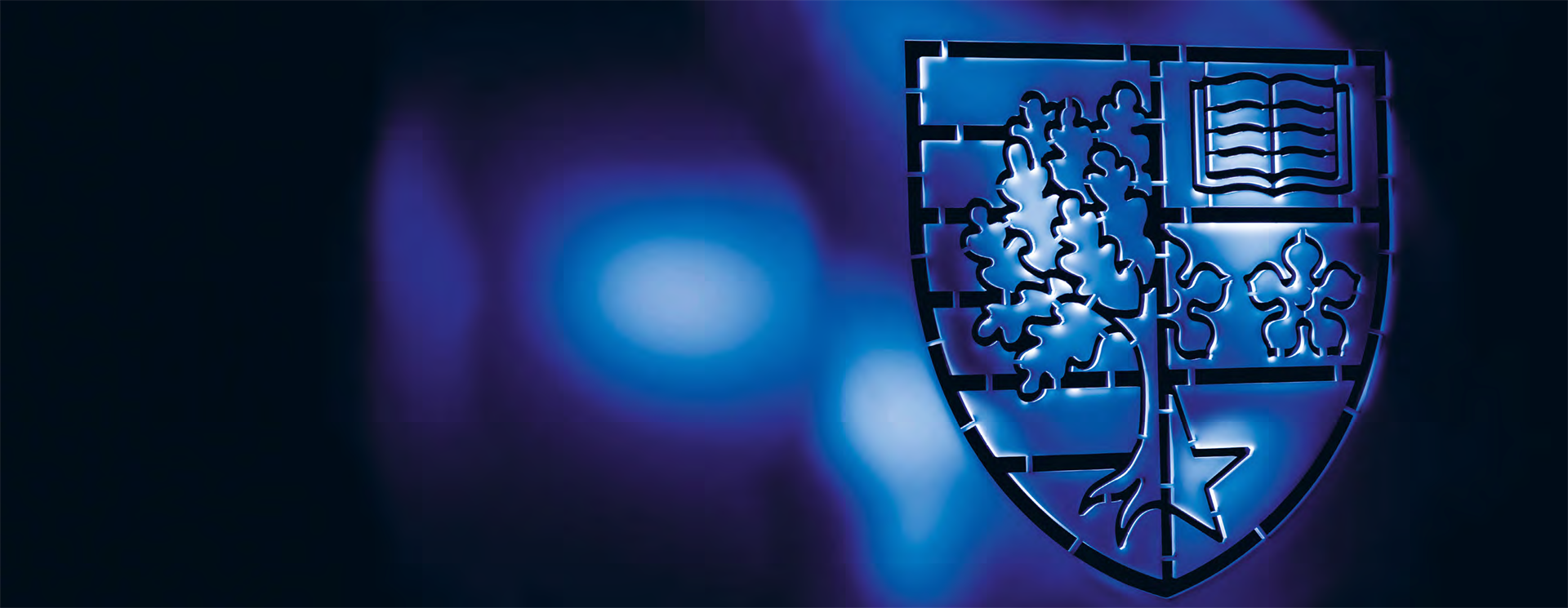 The Heriot-Watt shield on a blue background