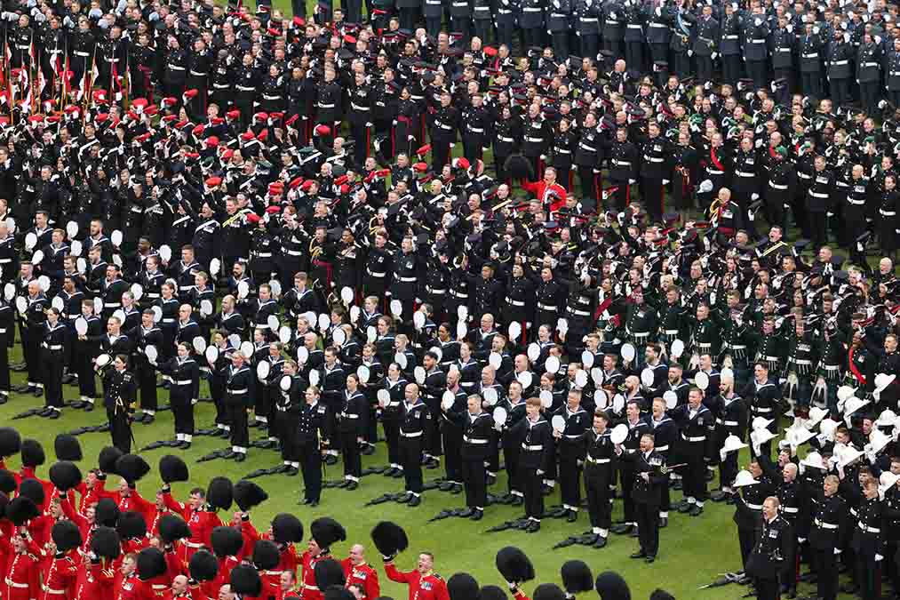 Thousands of UK and Commonwealth service personnel give the King and Queen ‘three cheers’ in the gardens of Buckingham Palace