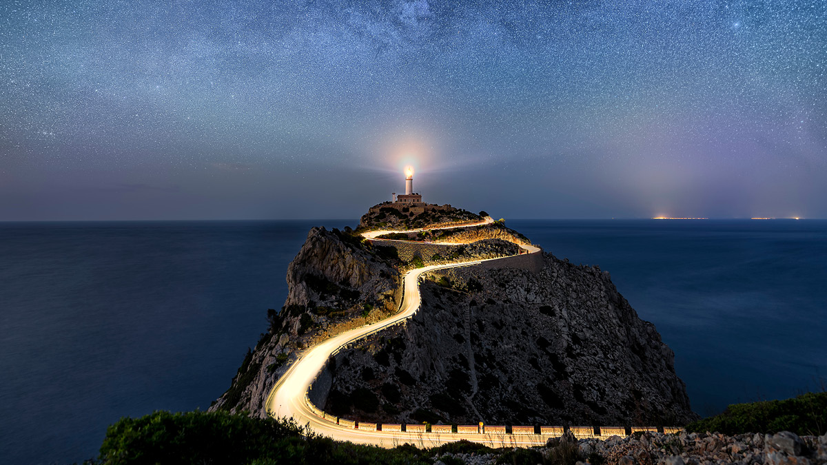 Image of a lighthouse guiding in the dark
