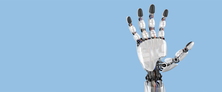 A metallic robot hand against a blue screen