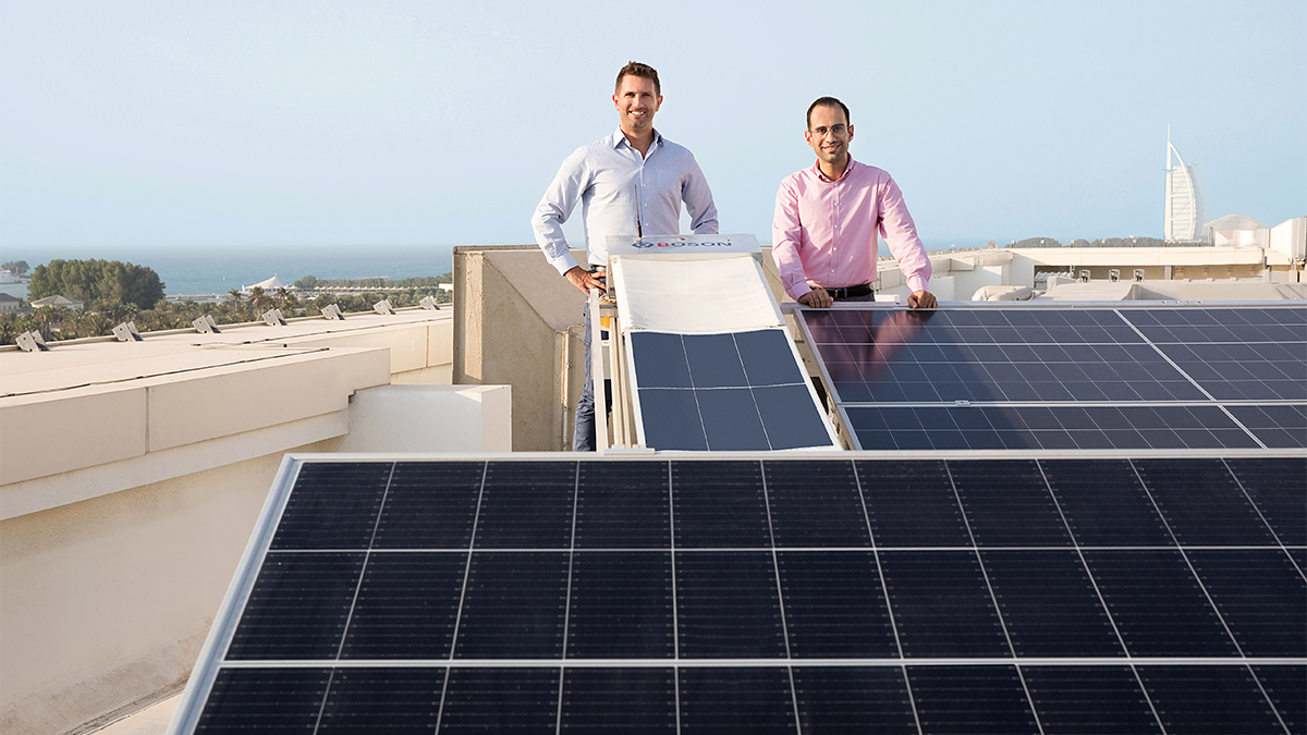 Tadhg O'Donovan (left) and Mohamed Al-Musleh at the rooftop Solar Energy Test Site.