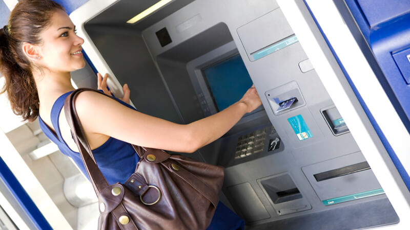 Female using ATM