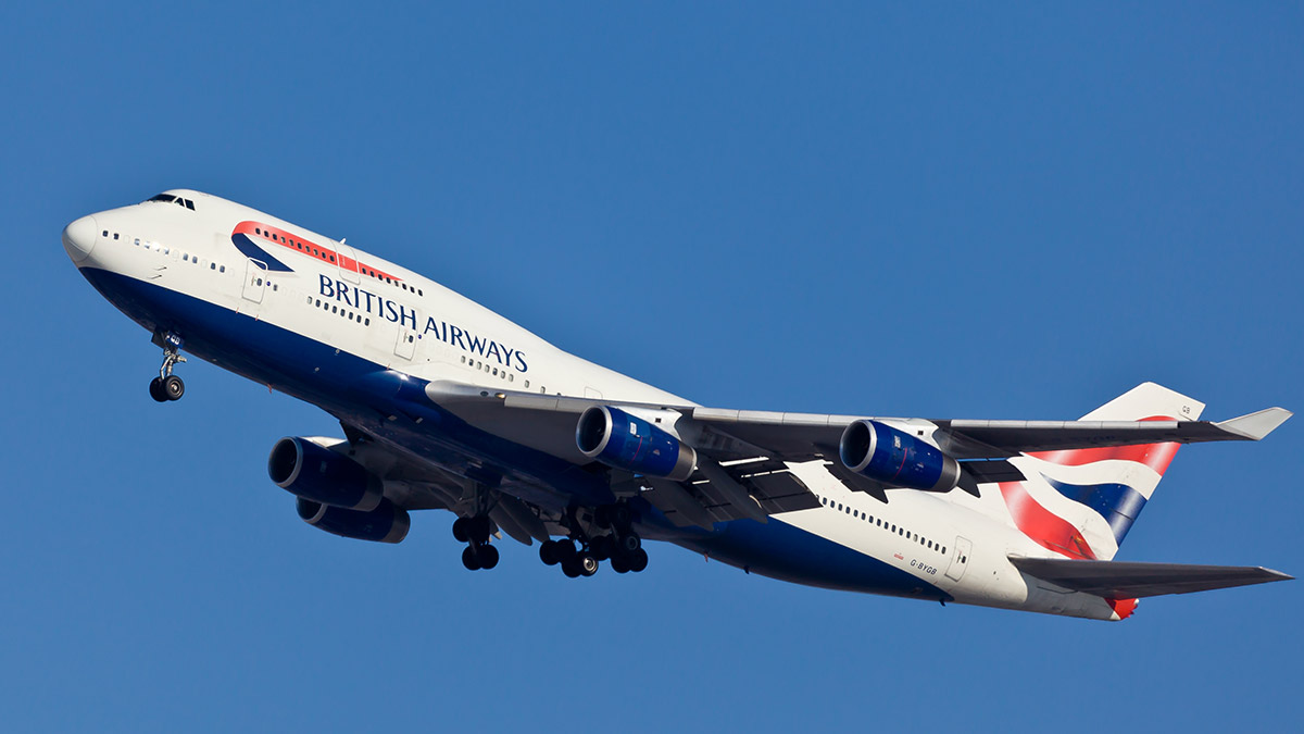 A British Airways jet climbs into a clear blue sky