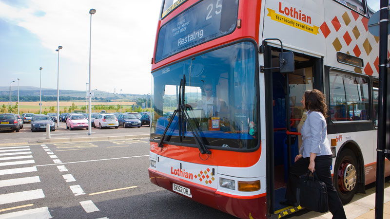 Female passenger boarding bus