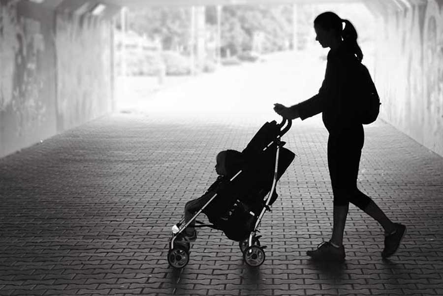 Woman with child in buggy