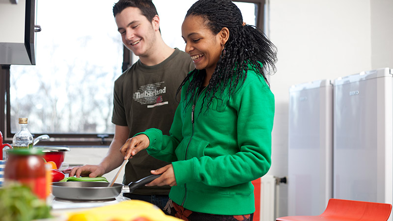 Students cooking in kitchen