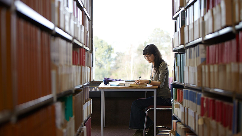 Female student working in the Library