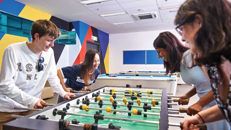 Students playing table football