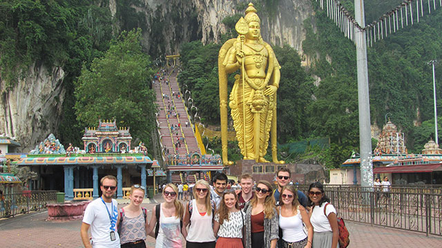 Students in front of shrine in Malaysia