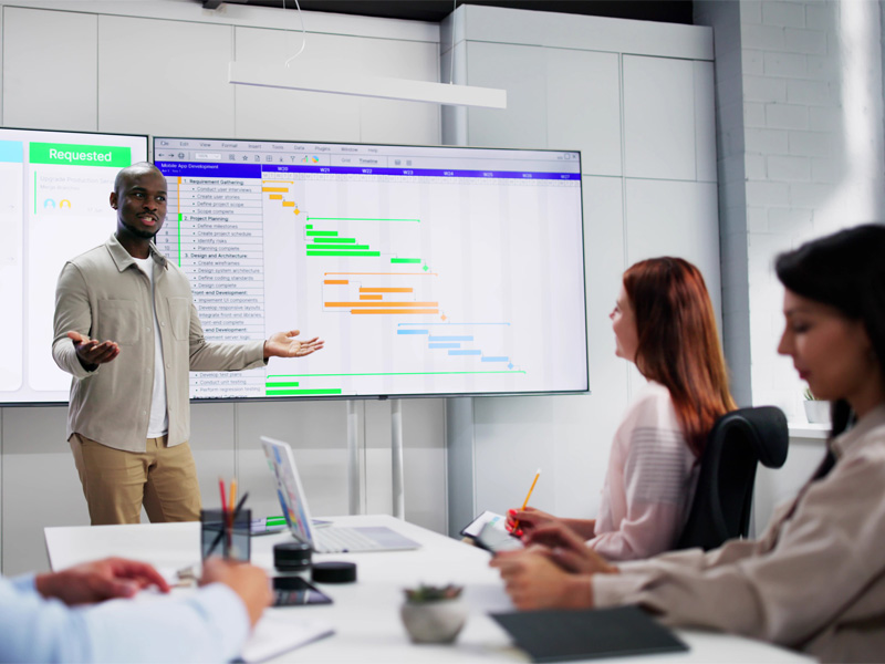 A speaker addresses a group, sharing insights and information during a presentation.