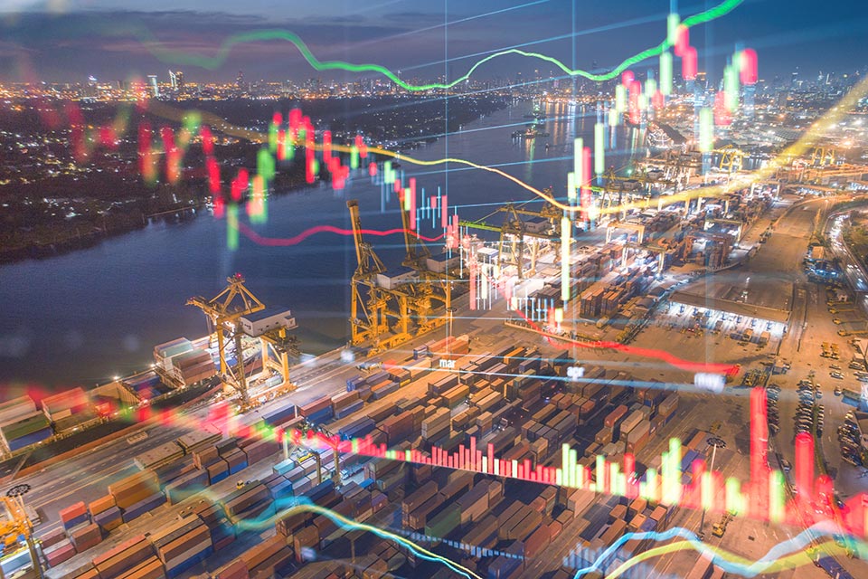 Aerial view of container shipping port operations with bar chart illuminations superimposed