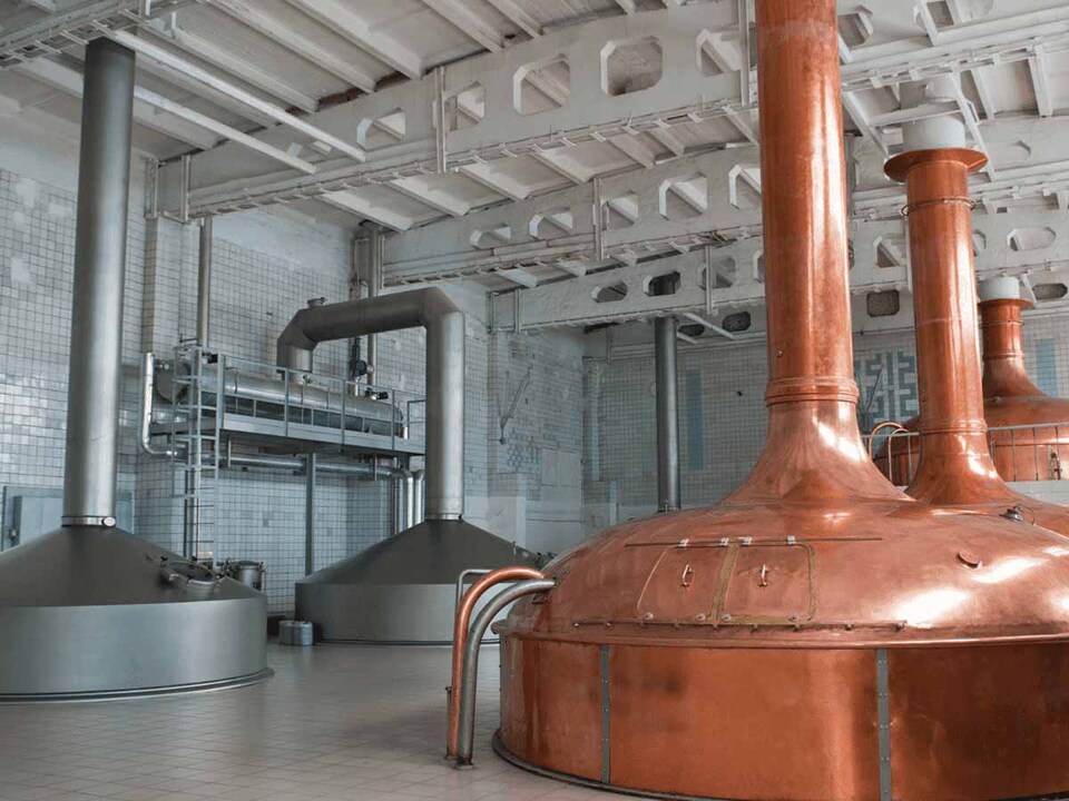 Distillery interior with brass pot stills