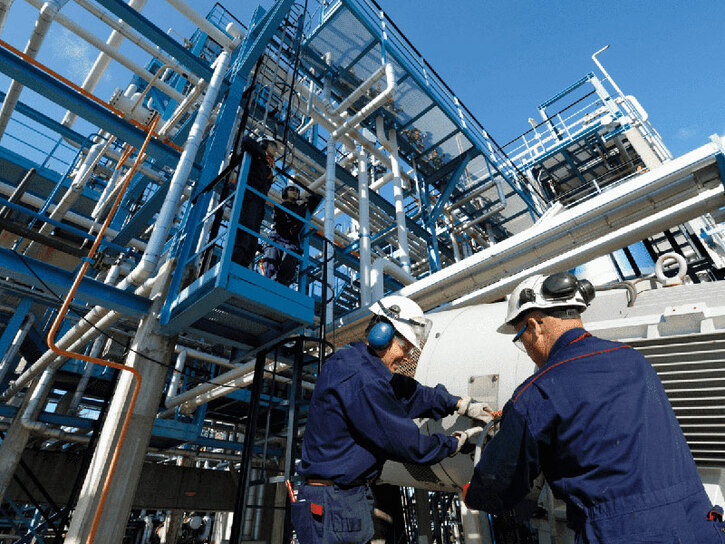 Mechanical engineers working at a processing plant