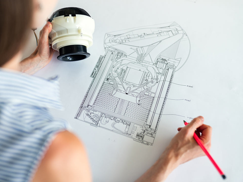 engineer doing a technical drawing of equipment