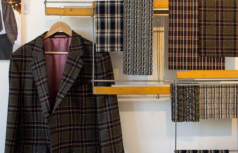 squares of different neutral coloured check prints hanging on hanger 