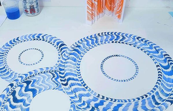 blue and white drawn plate design